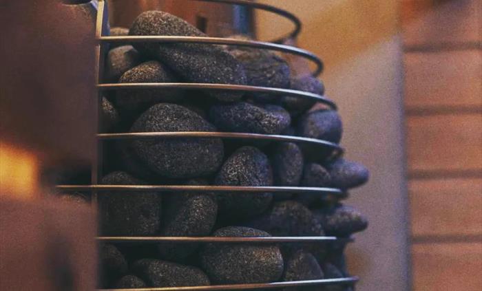 Discover serenity amid sauna rocks at Logi Saunas, where the soothing warmth emanates from meticulously arranged stones, creating a haven for relaxati